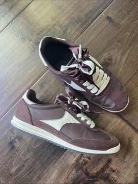 Woman’s brown sneaker